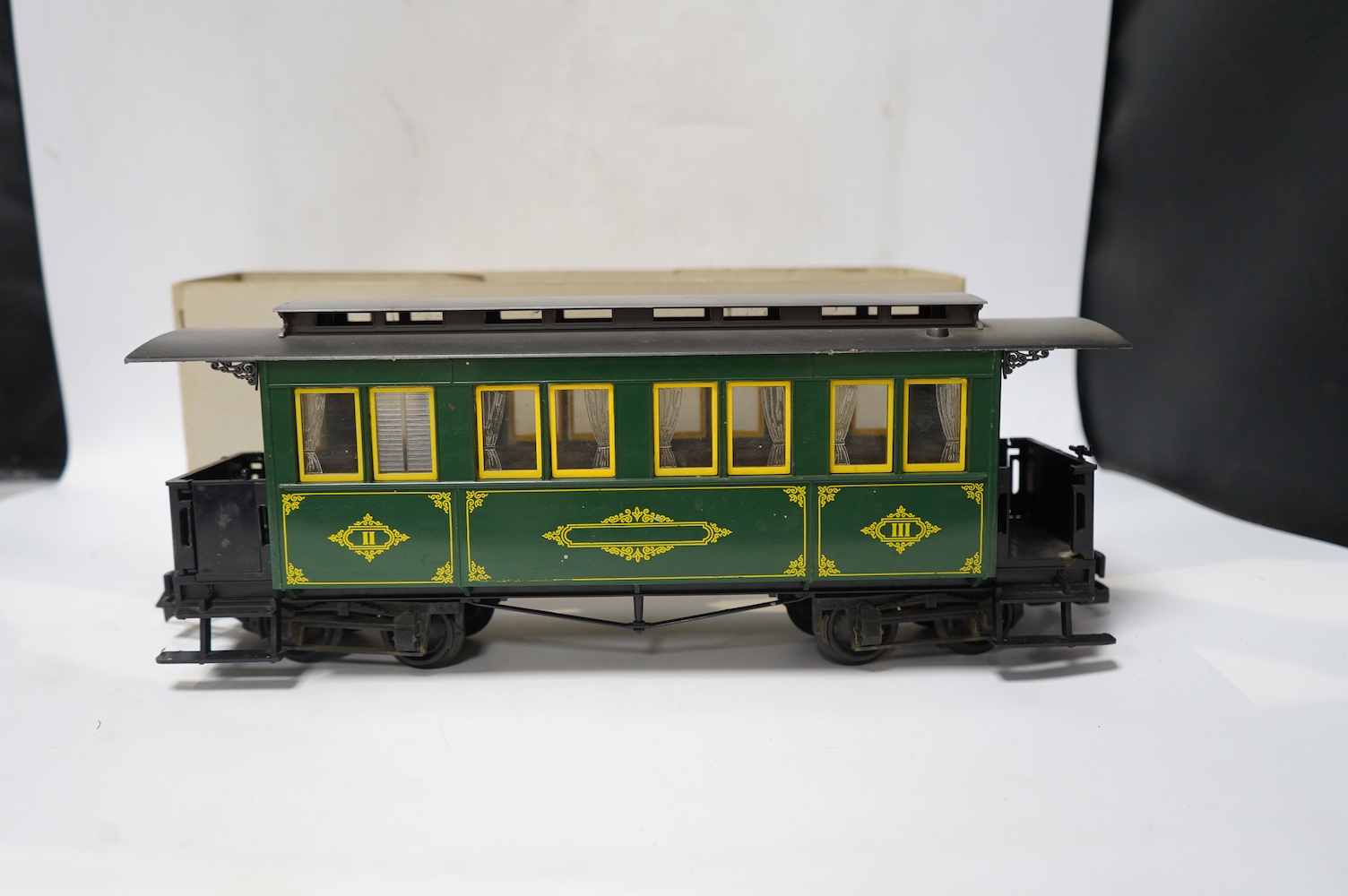 Four boxed Lehmann LGB G scale coaches; a bogie coach (3060), and three 4-wheel coaches (3106 and 2x 3050). Condition - good.